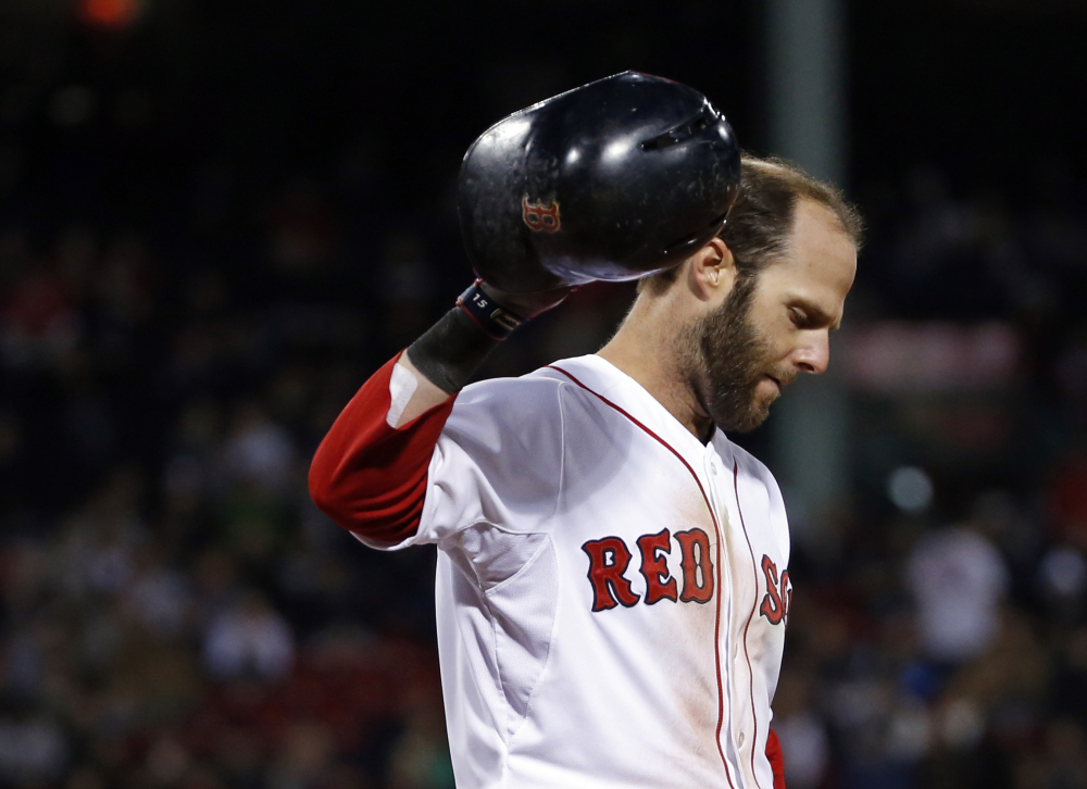Boston Red Sox’s Dustin Pedroia reacts after grounding out to make the last out in the seventh inning against the Texas Rangers in a baseball game at Fenway Park in Boston, Tuesday, April 8, 2014. The Rangers won 10-7.