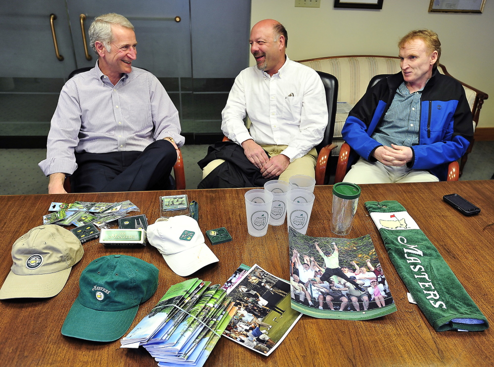 Local golf enthusiasts, from left, David Ray, David Chipman and Scott Brown, talk about their experiences going to the Masters behind a collection of memorabilia owned by Ray.
