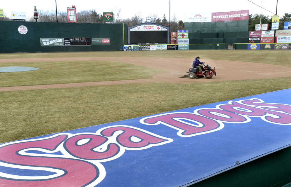 Jason Cooke, of the Sea Dogs grounds crew, works Hadlock Field on Wednesday in anticipation of today’s home opener against the New Britain Rock Cats. Opening ceremonies begin at 5:50 p.m. and the game starts half an hour later.