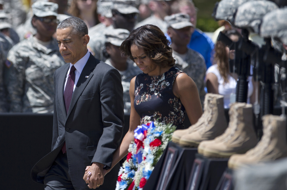 President Obama and first lady Michelle Obama arrive for a memorial ceremony Wednesday at Fort Hood, Texas.