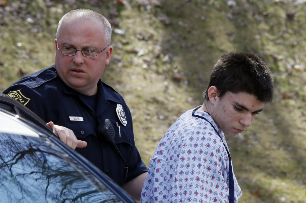 Alex Hribal, 16, the suspect in the multiple stabbings at the Franklin Regional High School in Murrysville, Pa., is escorted by police to his arraignment on Wednesday.