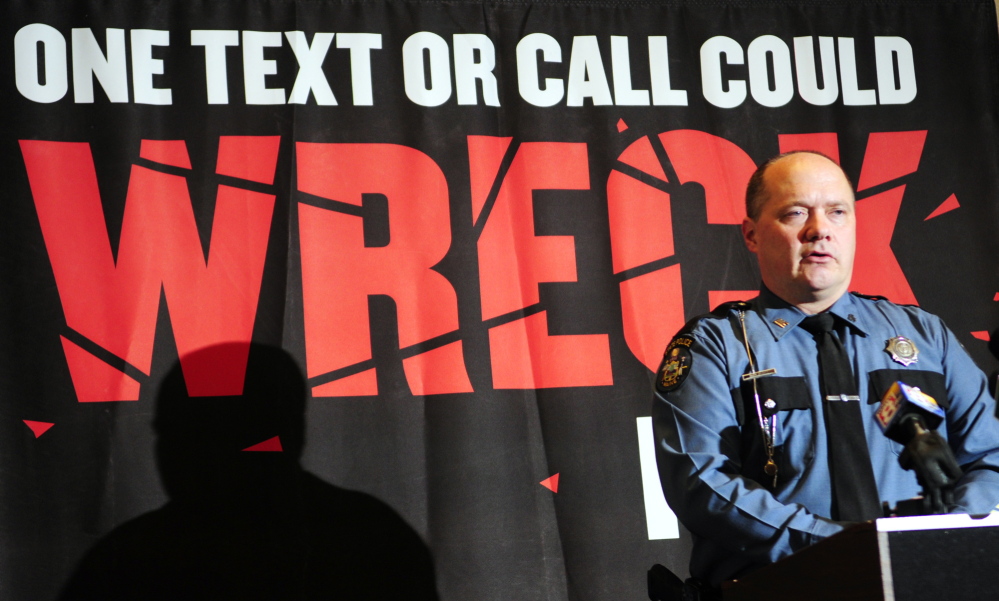 cracking down: Maine State Police Trooper Duane Doughty talks about distracted driving during a news conference on Thursday in Augusta.