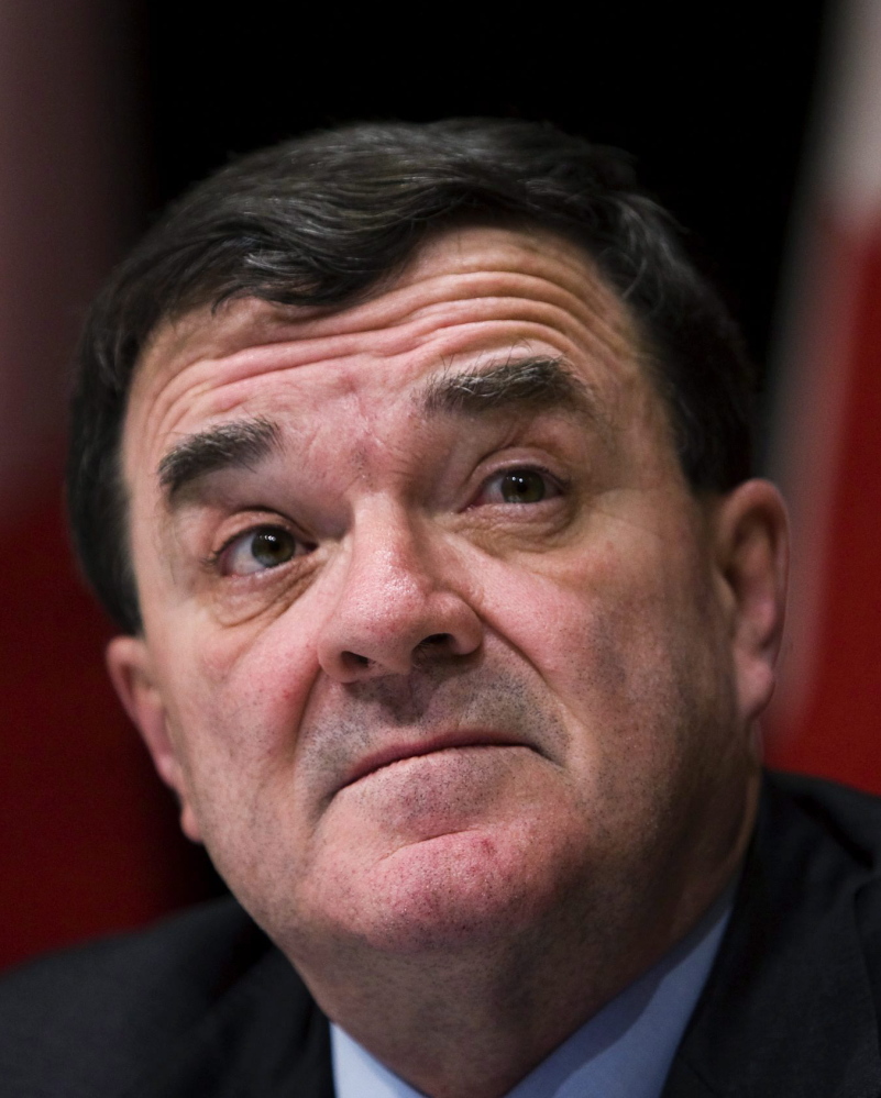Jim Flaherty listens to questions at a meeting in 2009. The Quebec native spent nearly 20 years in politics. He died Thursday at age 64.