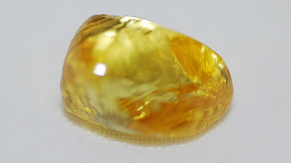 This photo provided by Crater of Diamonds State Park shows a 3.85-carat canary diamond discovered by Tana Clymer. The diamond is about the size of a jellybean.