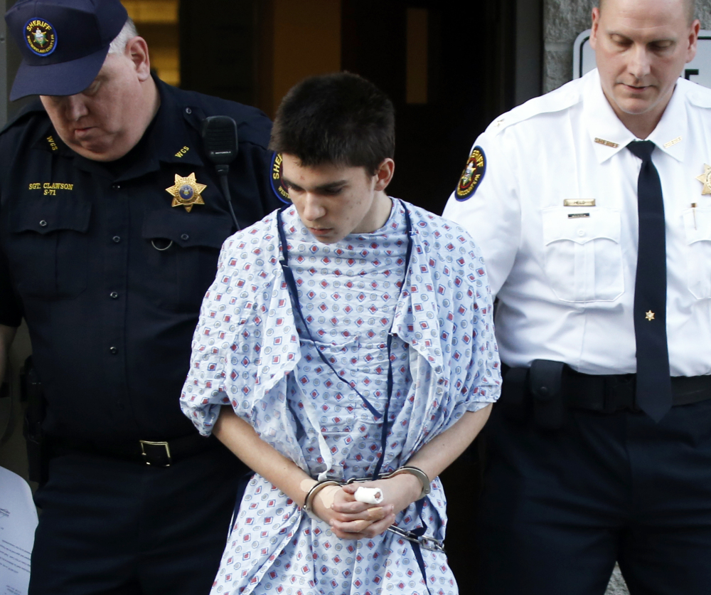Alex Hribal, the suspect in the stabbings at a high school near Pittsburgh, is taken from a district magistrate’s court after he was arraigned on charges from the attack.