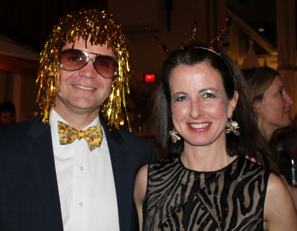 Geoff Wagg, head of school at Waynflete, gets into the spirit of the evening with his wife, Alice.