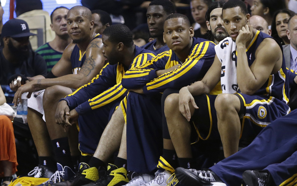David West, left, of the Indiana Pacers sits on the bench after fouling out in the second half of a 98-86 loss to the Miami Heat on Friday. The game had been anticipated as a battle between two top NBA teams, but Indiana again fell prey to a mediocre performance.