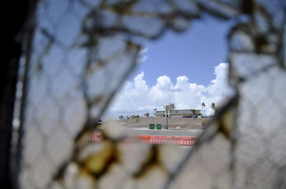 One of Guantanamo Bay’s two courthouses is seen through a broken window at Camp Justice at the U.S. naval base in Cuba. On Monday, a judge in Guantanamo will open a hearing into the sanity of prisoner Ramzi Binalshibh, whose courtroom outbursts about alleged mistreatment in Camp 7 at the base have halted the effort to try five men in the Sept. 11 attacks, all of whom are held there.