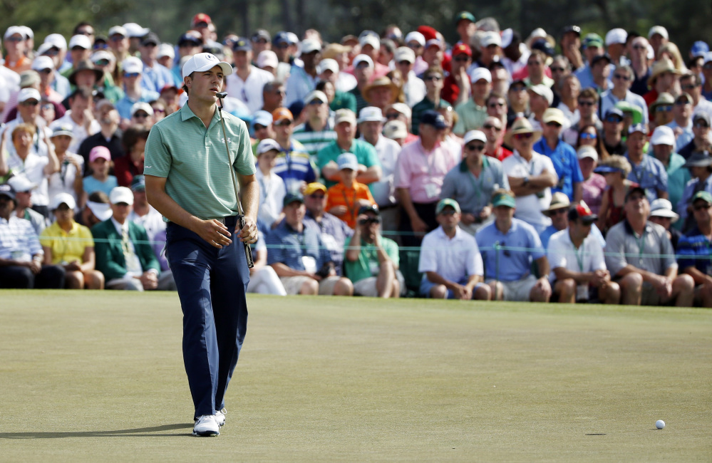 Jordan Spieth reacts as his ball misses the cup on the ninth hole for a birdie during the fourth round of the Masters.