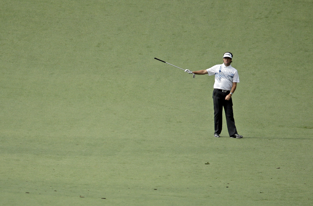 Bubba Watson points to his approach shot on the 10th hole during the fourth round of the Masters on Sunday.