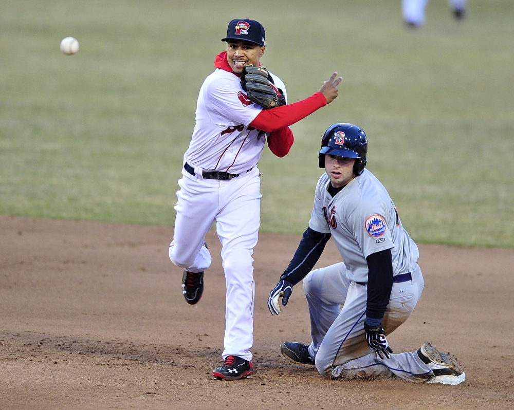 Sea Dogs second baseman Mookie Betts fires to first to complete the double play as Binghamton’s Kevin Plawecki watches.