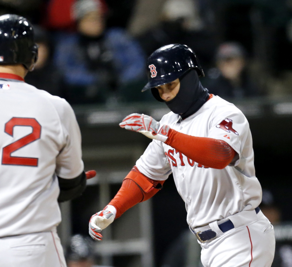 Daniel Nava of the Boston Red Sox, right, celebrates Tuesday night after hitting a home run against the Chicago White Sox.