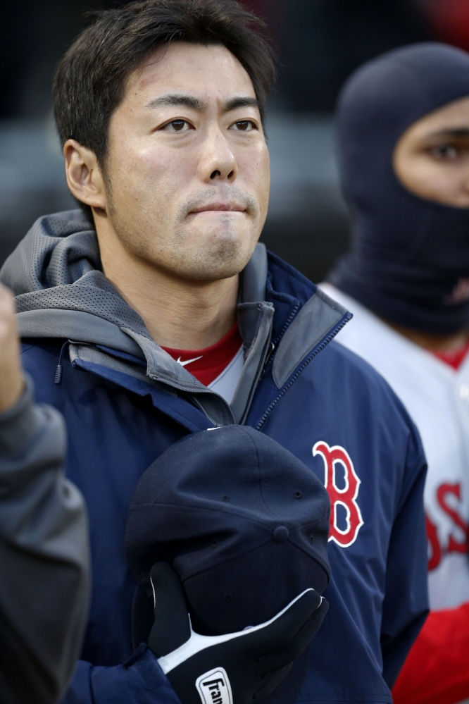 Red Sox relief pitcher Koji Uehara pauses during the pre-game Boston Marathon tribute.