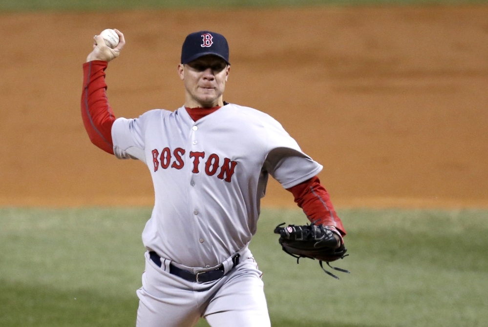 Boston Red Sox starting pitcher Jake Peavy delivers during the second inning of a baseball game against the Chicago White Sox on Tuesday, April 15, 2014, in Chicago. (AP Photo/Charles Rex Arbogast)