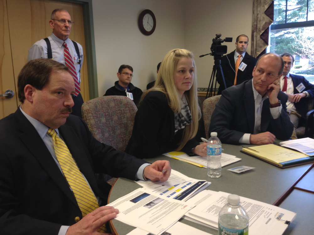 From left, Cate Street Capital officials Dammon Frecker and Alexandra Ritchie, and its attorney Christopher Howard attend the FAME board meeting in Augusta on Thursday.