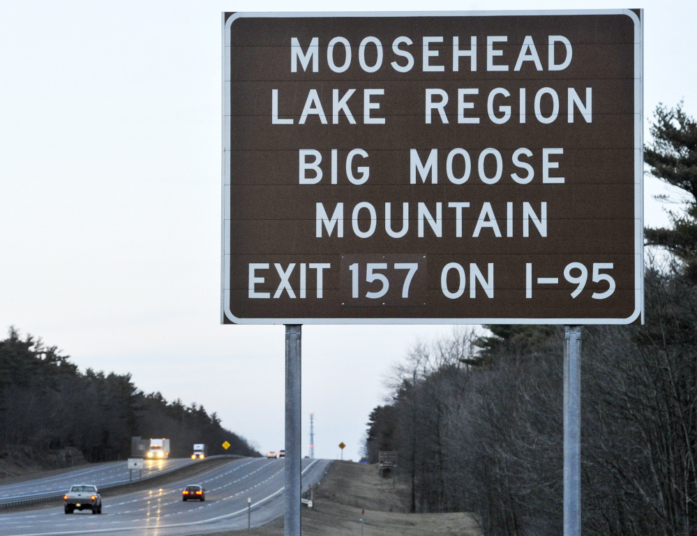 A bill that Gov. Paul LePage signed into law targets brown and white highway signs that direct visitors to attractions.