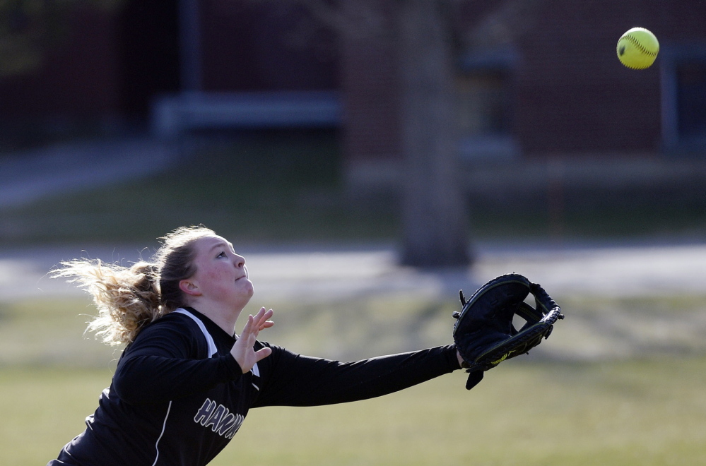 Courtney Taylor, a Marshwood oufielder, chases down a foul ball. Thursday was the opening day for spring high school sports throughout the state.