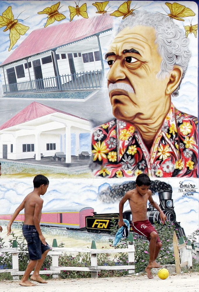 In this Jananuary 2006 file photo, boys play soccer in front a mural of Colombian Nobel laureate Gabriel Garcia Marquez in Aracataca, Colombia, the writer’s hometown.