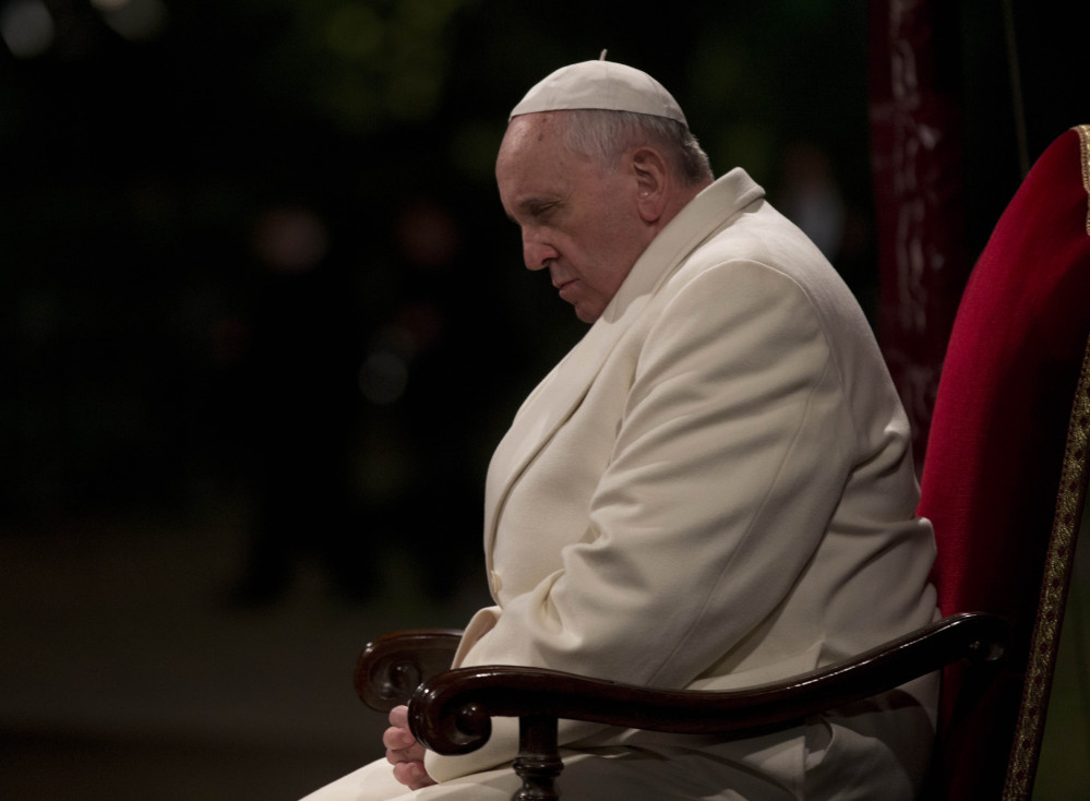 Pope Francis attends the Way of the Cross torchlight ceremony marking Good Friday in Rome.