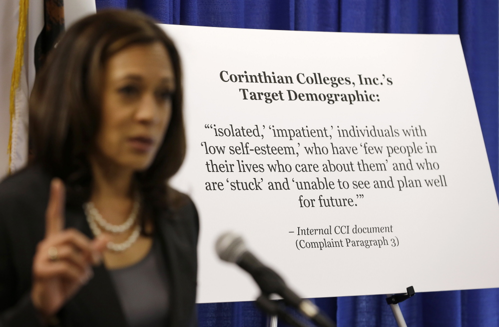 California Attorney General Kamala Harris stands next to a statement of the target demographic of the for-profit Corinthian Colleges Inc., which is facing a lawsuit.