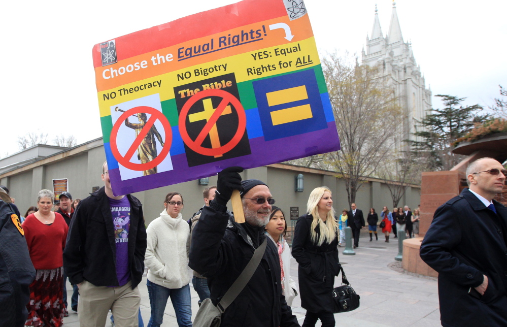 Utah atheists, most of them former Mormons, march around Salt Lake Temple Square in Salt Lake City on April 6 during the faith’s general conference.