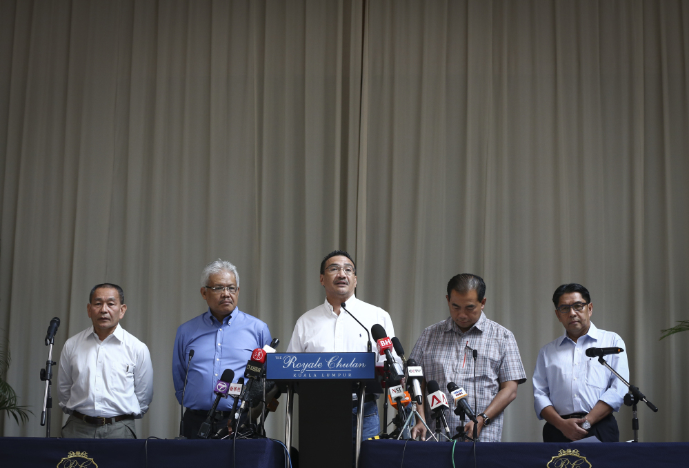 From left to right, Malaysia Airlines Group CEO Ahmad Jauhari Yahya, Deputy Minister of Foreign Affairs Hamzah Zainudin, Malaysia’s acting Transport Minister Hishammuddin Hussein, third from left, Deputy Minister, Abdul Aziz Kaprawi and Malaysian Department of Civil Aviation, Azharuddin Abdul Rahman attend a press conference for the missing Malaysia Airline, MH370 at a hotel in Kuala Lumpur, Malaysia, Saturday.