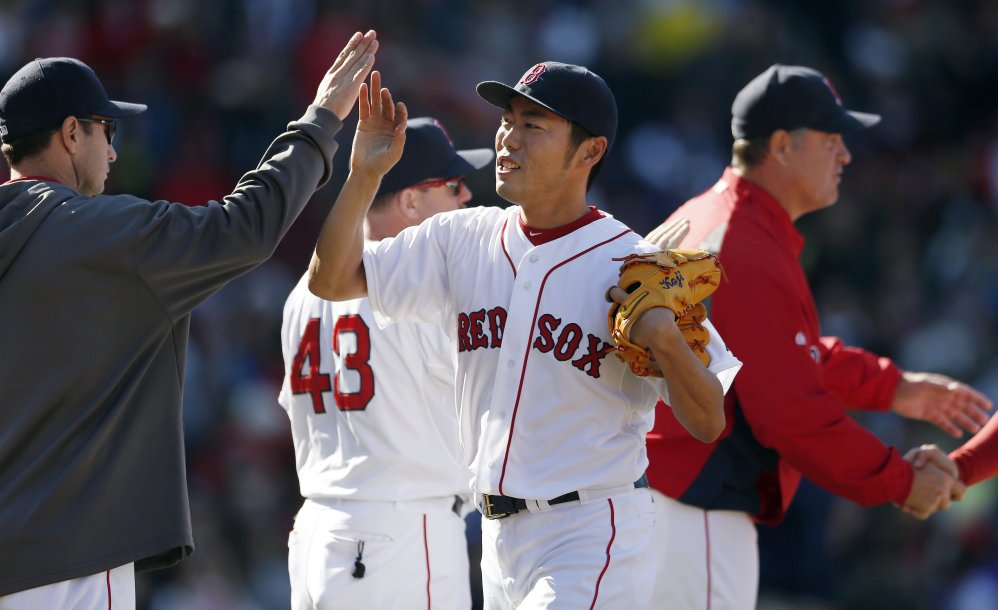 Boston Red Sox closer Koji Uehara celebrates after the team defeated the Baltimore Orioles 4-2 in Boston on Saturday.