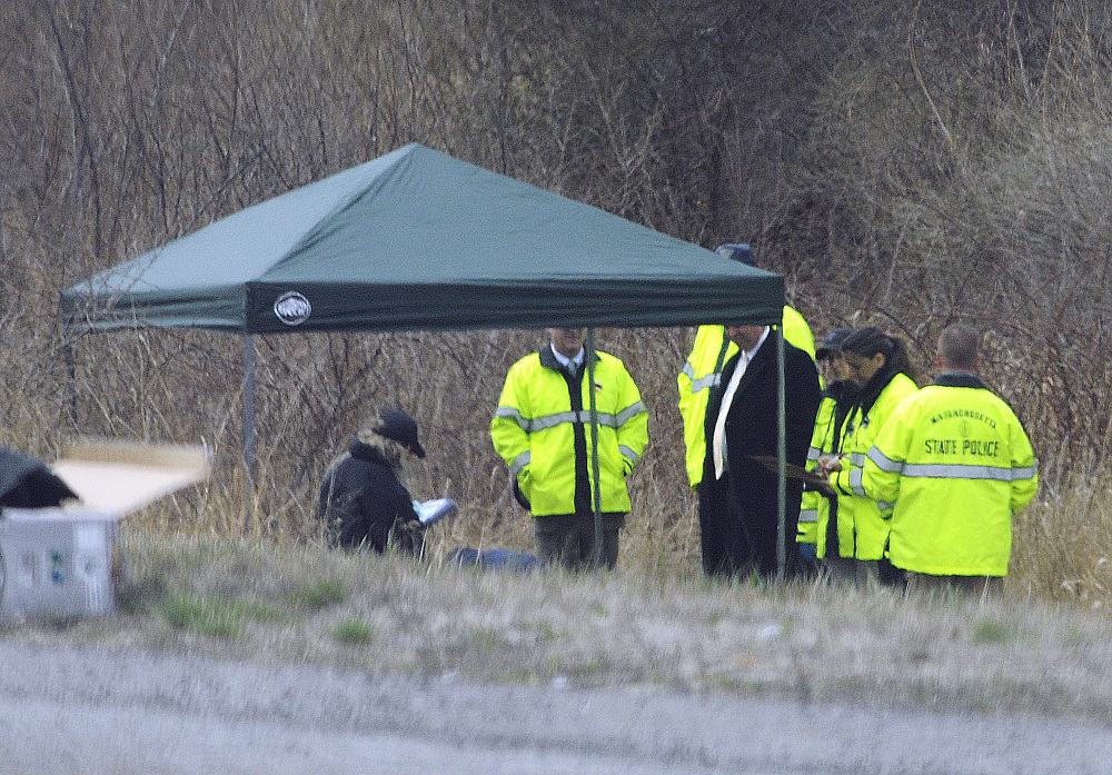 Massachusetts State Police stand along Interstate 190 near Sterling, Mass. where police said a child’s body, now confirmed to be that of 5-year-old Jeremiah Oliver, was found Friday. The boy was last seen by relatives in September 2013 but wasn’t reported missing until December. His mother Elsa Oliver and her boyfriend Alberto Sierra are both charged in the case.