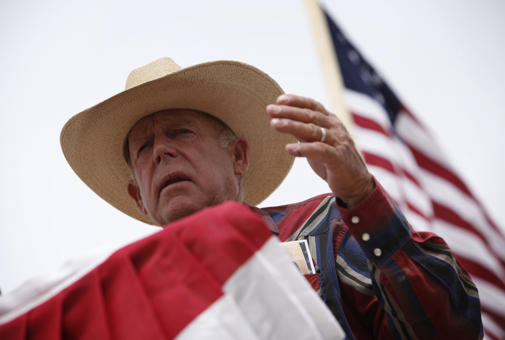 Rancher Cliven Bundy speaks at a protest camp near Bunkerville, Nev., on Friday.