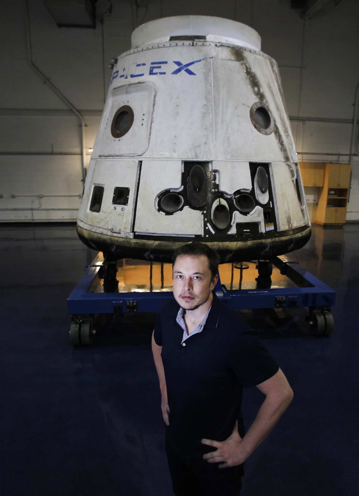 Elon Musk poses with the SpaceX Dragon capsule in Hawthorne, Calif., in 2012. “I have no doubt that he will get man to Mars in his lifetime,” said his dad, Errol Musk.