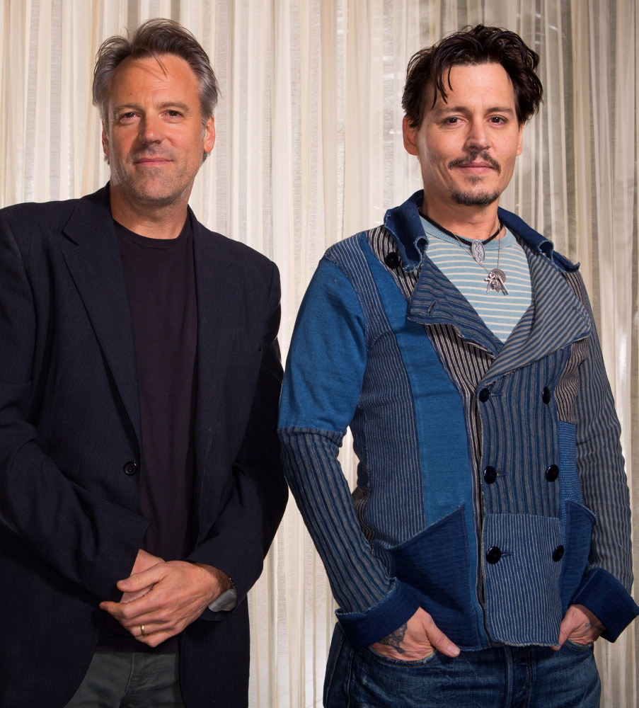 “Transcendence” director Wally Pfister, left, with his star, Johnny Depp