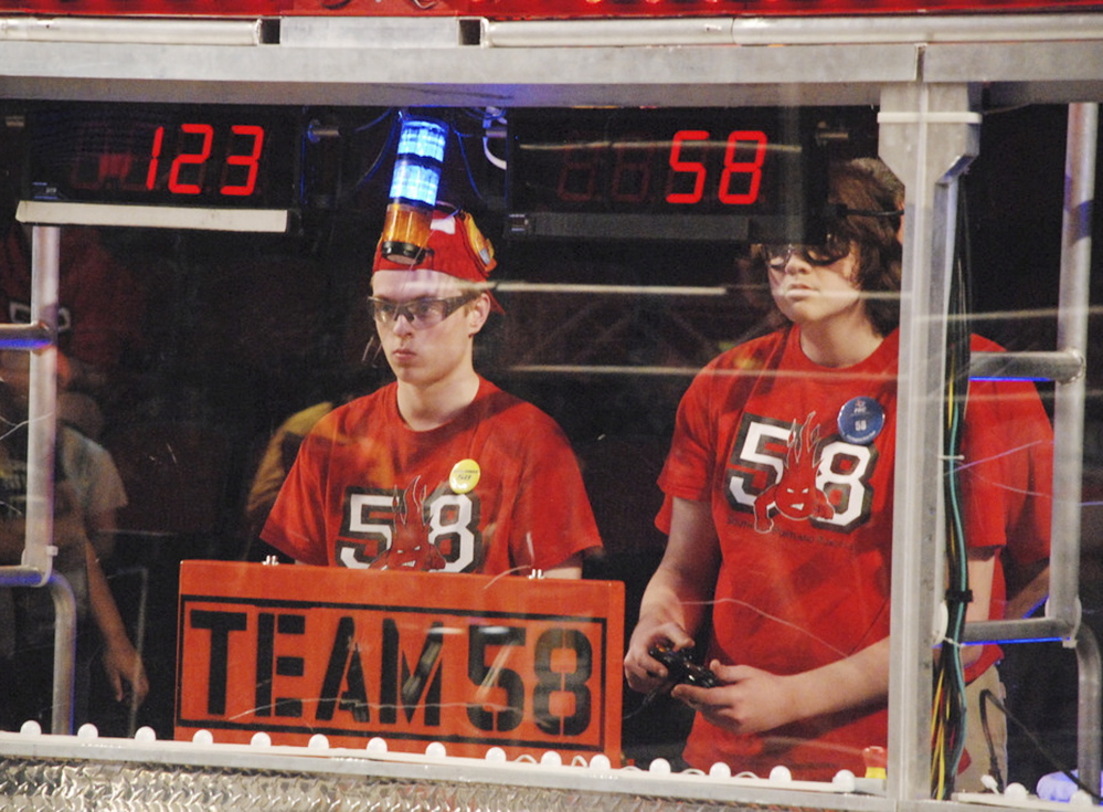 Ross Usinger, left, and Alexander Manning compete for the Riot Crew robotics team from South Portland.