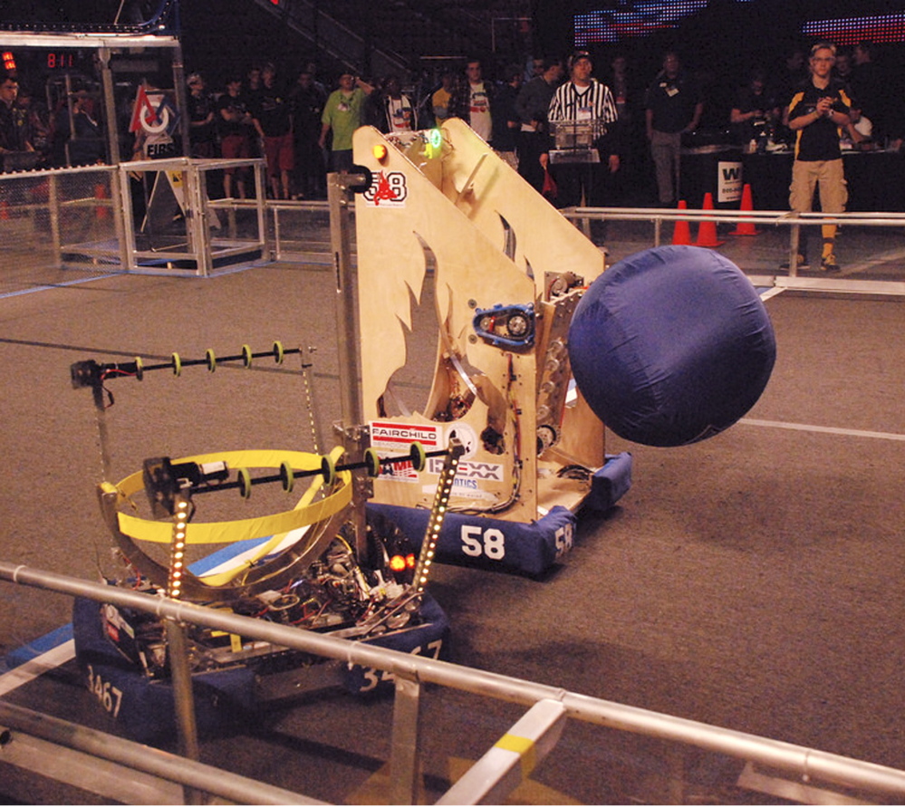 Windham Windup’s robot works with the Riot Crew’s robot.