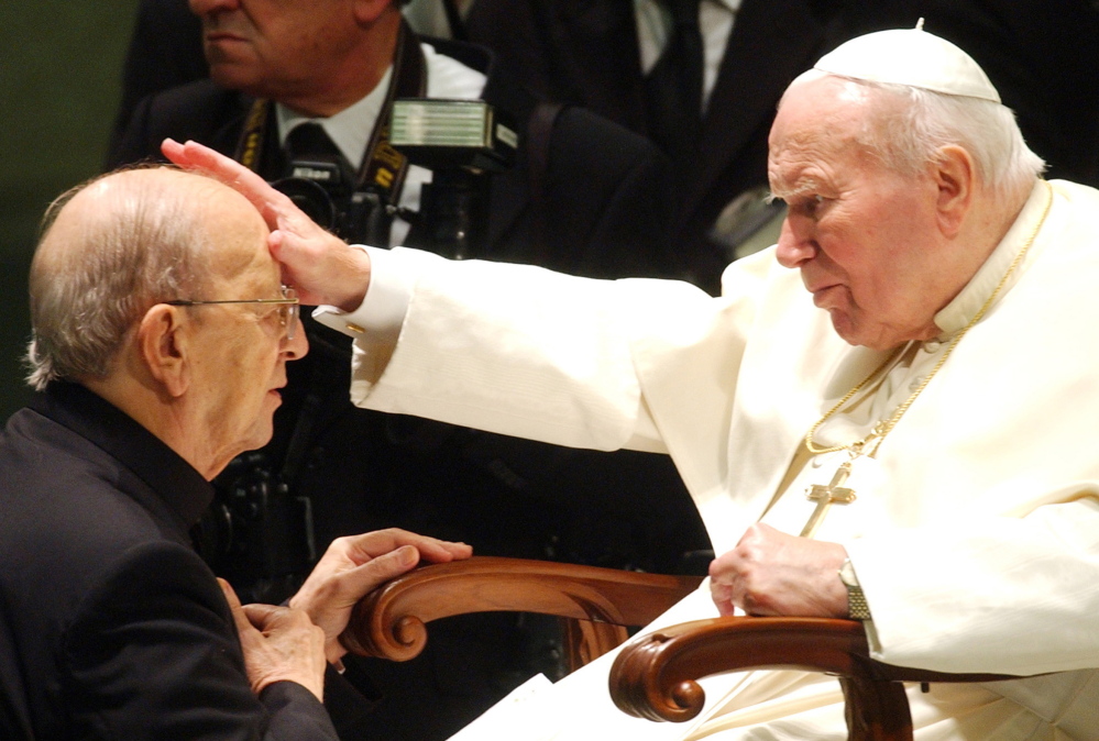Pope John Paul II gives his blessing to late priest Marcial Maciel in 2004. The Vatican suspended Maciel for two years to kick a morphine habit but, according to documents, overlooked other abuses and financial improprieties.