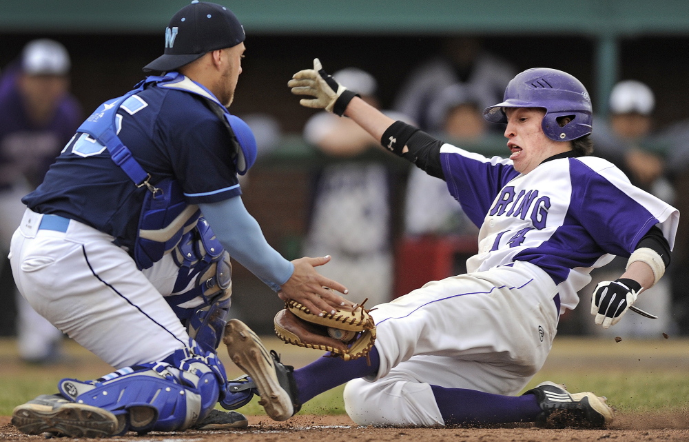 It’s the play that made have decided the SMAA opener Tuesday. Westbrook catcher Kyle Heath slaps a tag on Ben Peterson of Deering, who, on a bases-loaded, no-out situation, trailing 2-0 in the fourth, attempted to score on a short fly to right. Didn’t happen and Westbrook won, 5-1.
