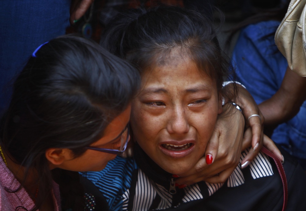 A relative of one of the Nepalese climbers killed in an avalanche on Mount Everest cries during the funeral ceremony in Katmandu, Nepal, Monday. The avalanche killed at least 13 Sherpas. Three other Sherpas remain missing and are presumed dead.