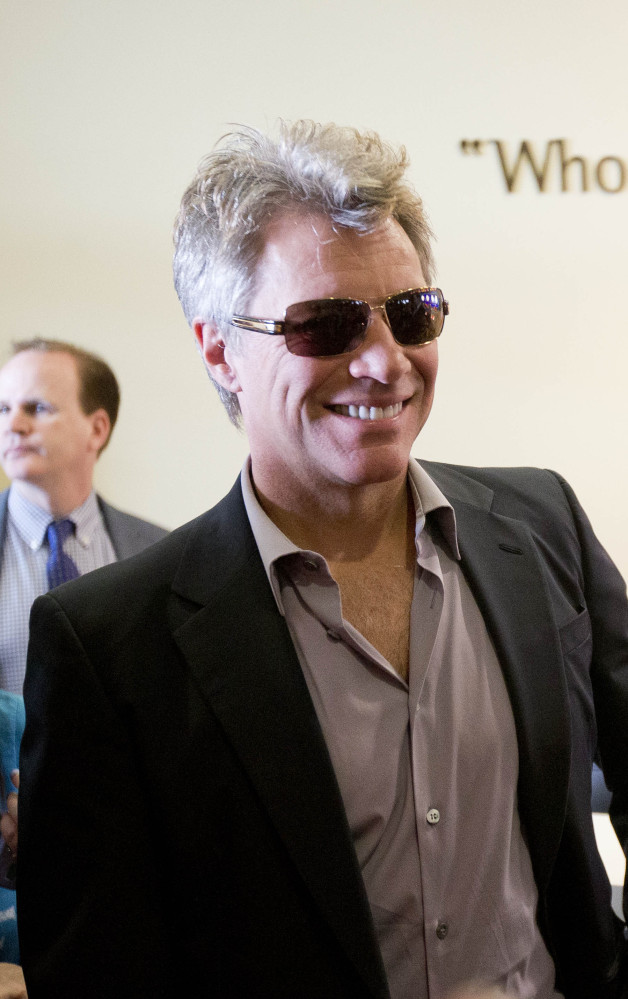 Jon Bon Jovi walks through the lobby of the JBJ Soul Homes during the grand opening Tuesday.