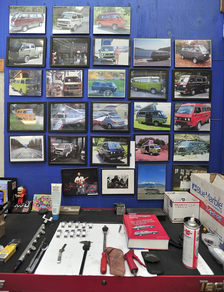 Photos of completed projects line the wall behind a work bench at Foreign Auto & Supply Inc. in Harpswell. Services can cost tens of thousands of dollars, depending on the scope of the project.