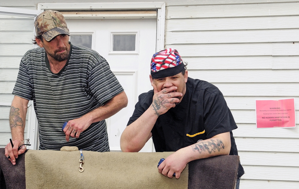 Tyson Joseph Goldstein, left, and Brett Hollowell Sr. discuss what they might do if they’re evicted from Meadowbrook Trailer Park in Richmond. “I’m clueless, literally clueless,” Hollowell said. Water to the park was shut off Tuesday morning.