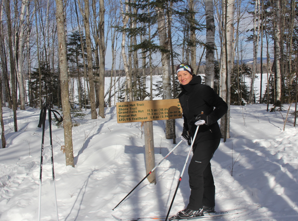 Sarah Pine, operations manager of Maine Huts & Trails, skis to work in winter and bikes in summer.