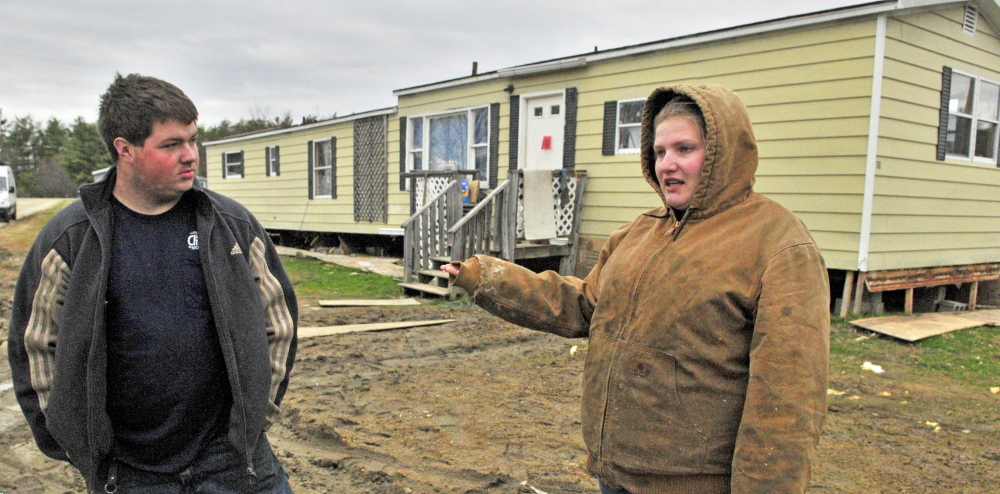 John Tuttle, left, and Harley Clifford talk about the problems they’ve had with water being shut off at Meadowbrook Trailer Park in Richmond.