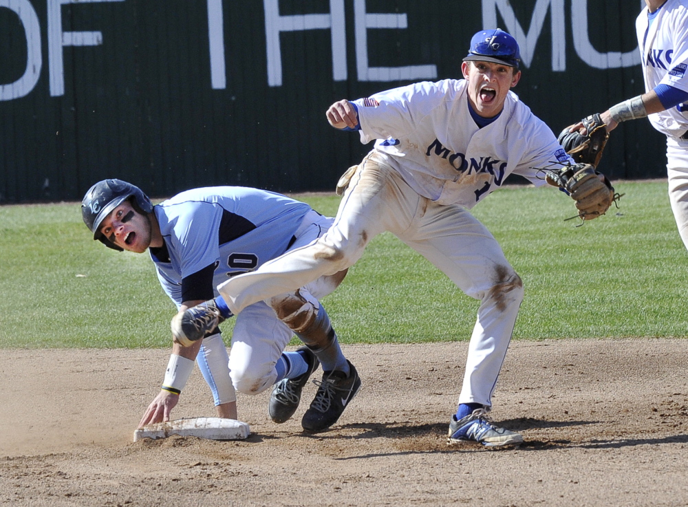 Max McCoomb of St. Joseph’s reacts Thursday after forcing Dan Gagnon of Lasell at second base and throwing to first to complete a double play at Standish. The Monks won 9-2 and will be home against top-seeded Suffolk at 1:30 p.m. Saturday in the GNAC tournament.