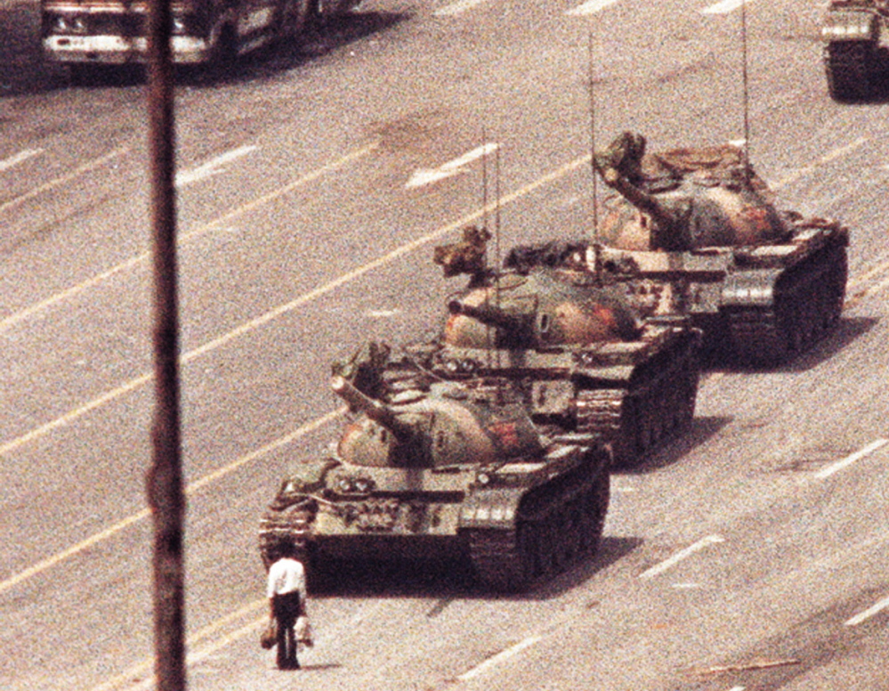 A man stands in front of a convoy of tanks in the Avenue of Eternal Peace in Beijing on June 5, 1989. The photo, by Jeff Widener, who was working for The Associated Press, was one of a handful that captured the moment.