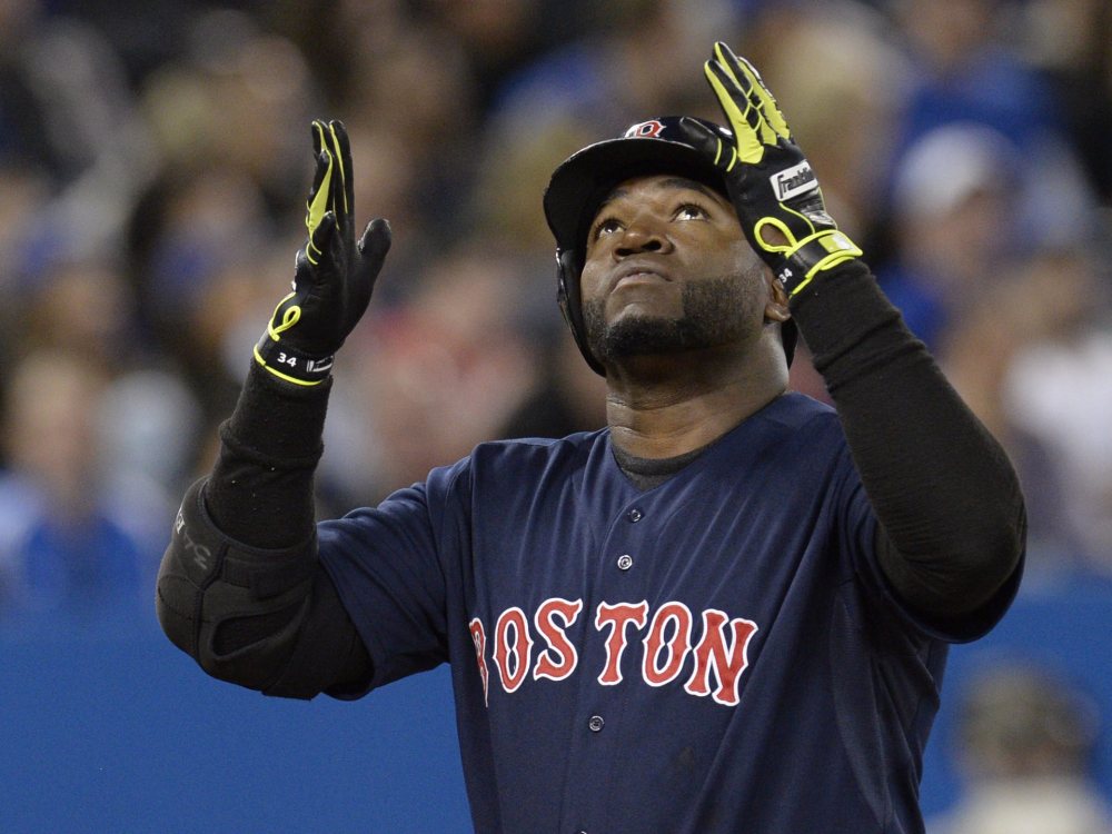 David Ortiz celebrates his solo home run as he crosses the plate during the third inning of Boston’s 8-1 win Friday night over the Toronto Blue Jays.