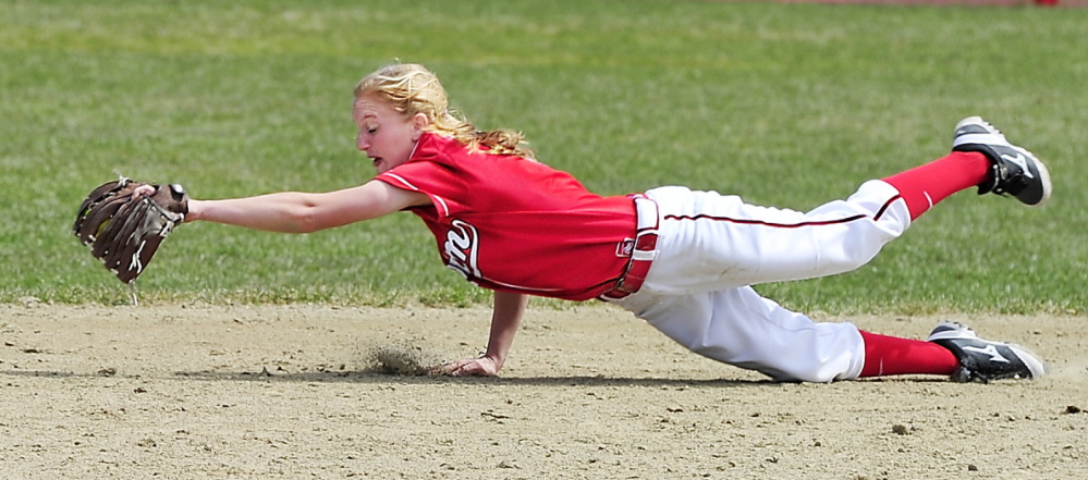 Scarborough second baseman Ashley Gleason dives to snag a hard grounder Friday during the 13-4 victory against visiting South Portland. Gleason also went 3 for 4 while batting in the No. 8 spot in the lineup.