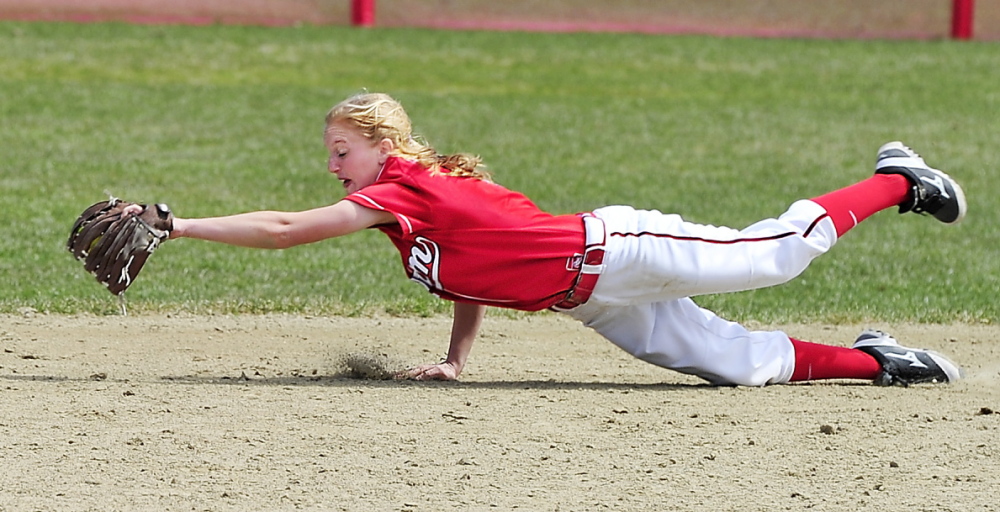 Scarborough second baseman Ashley Gleason dives to snag a hard grounder Friday during the 13-4 victory against visiting South Portland. Gleason also went 3 for 4 while batting in the No. 8 spot in the lineup.