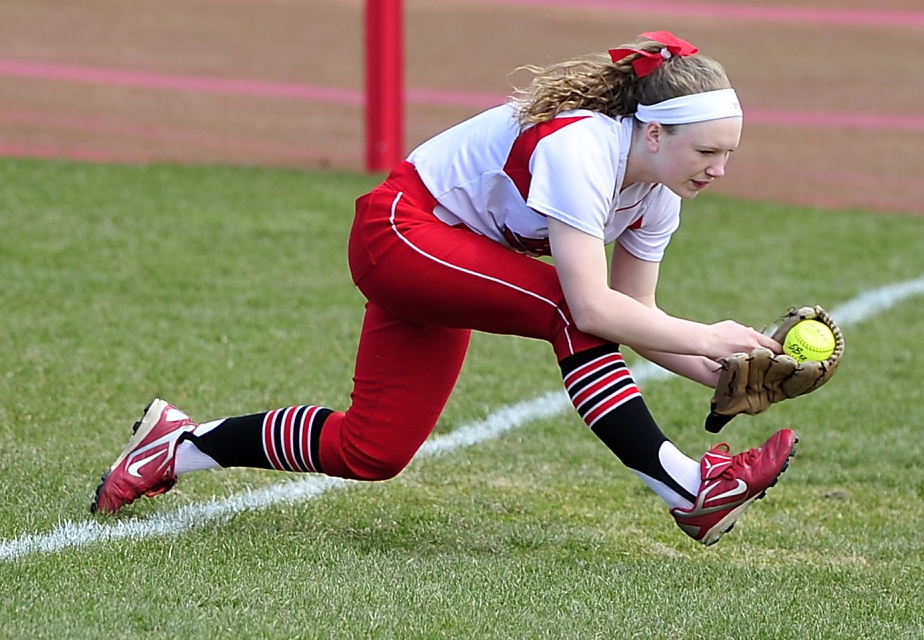 South Portland right fielder Madison Houlette keeps her balance and her poise to come up with a tough catch of a pop fly in foul ground.