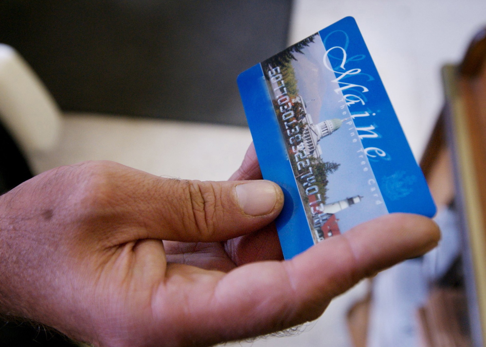 The state says it plans to begin putting photos on welfare benefit cards next week.