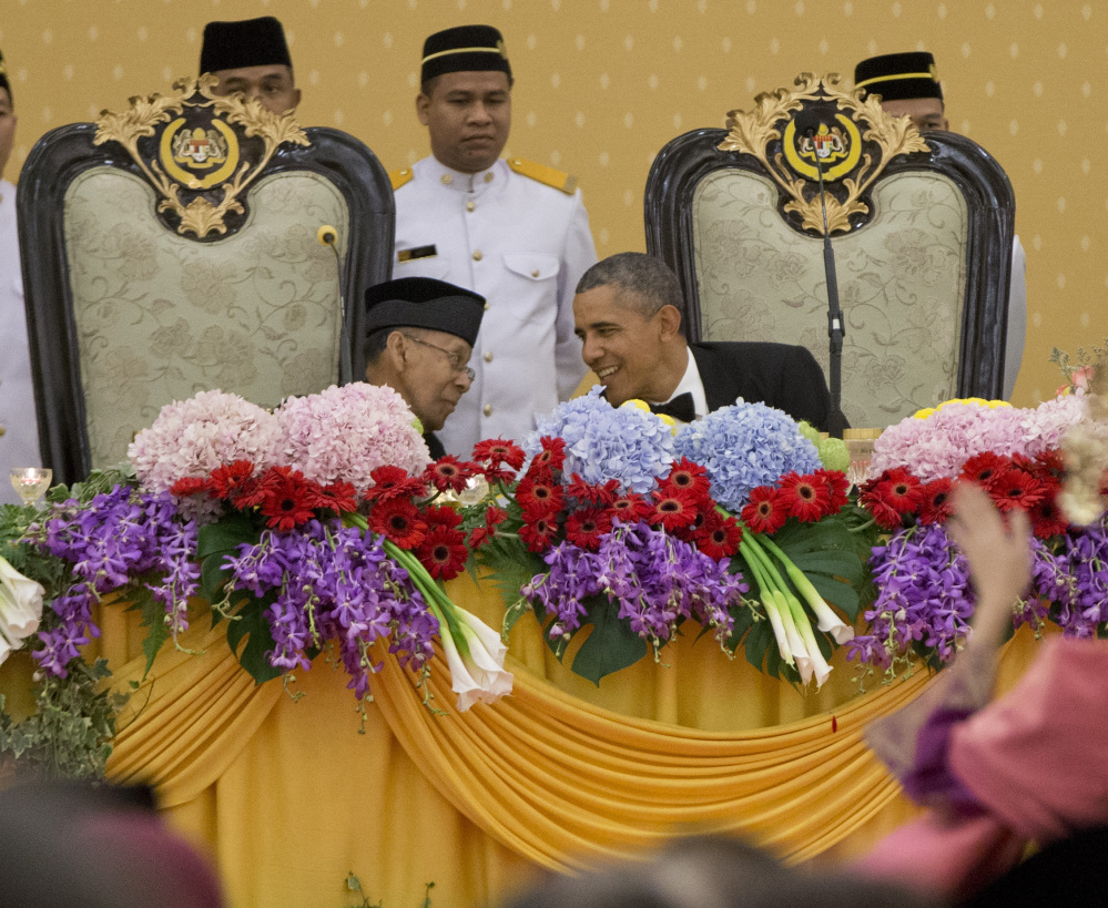 President Obama, right, talks with Malaysian King Abdul Halim Mu’adzam Shah during a state dinner at the King’s Palace or Istana Negara in, Kuala Lumpur, Malaysia, on Saturday. The last U.S. president to visit Malaysia was Lyndon B. Johnson in 1966.