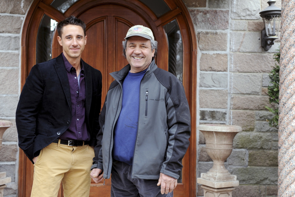Father and son Dominico, right, and Joseph Schinella stand outside Dominico’s home in Stamford, Conn. on April 7. Joseph is a real estate agent and his dad is a developer who worked his way up in the worlds of building and development.